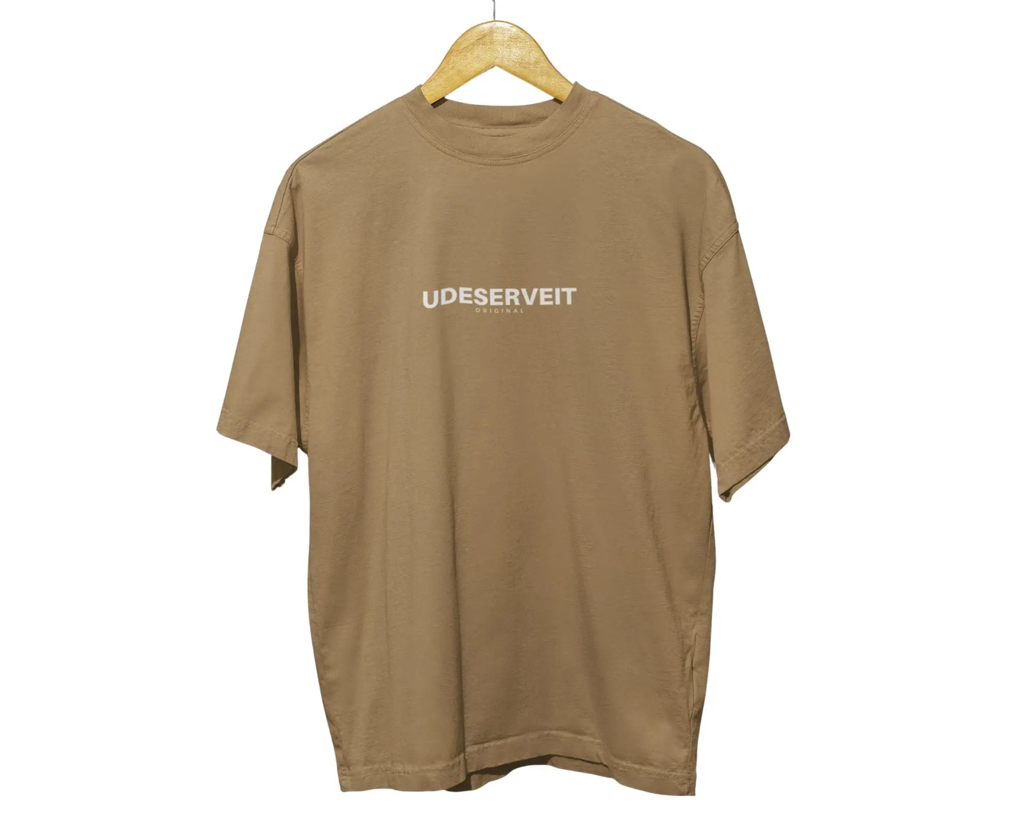 Brown t-shirt with 'UDESERVEIT' text on a hanger against a white background